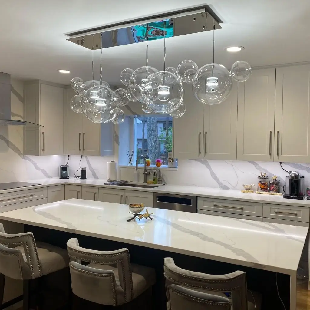 Chandelier installed in dining room in Portland home